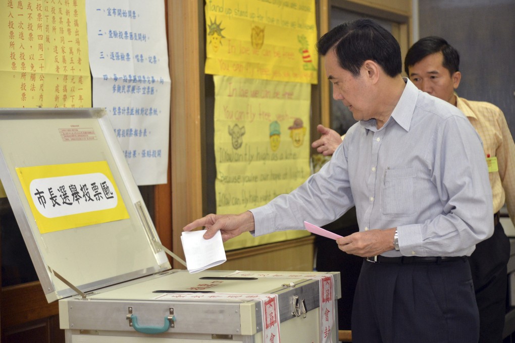 Taiwan's President Ma Ying-jeou casts his ballots in the local elections including Taipei mayor in Taipei. Photo: AP