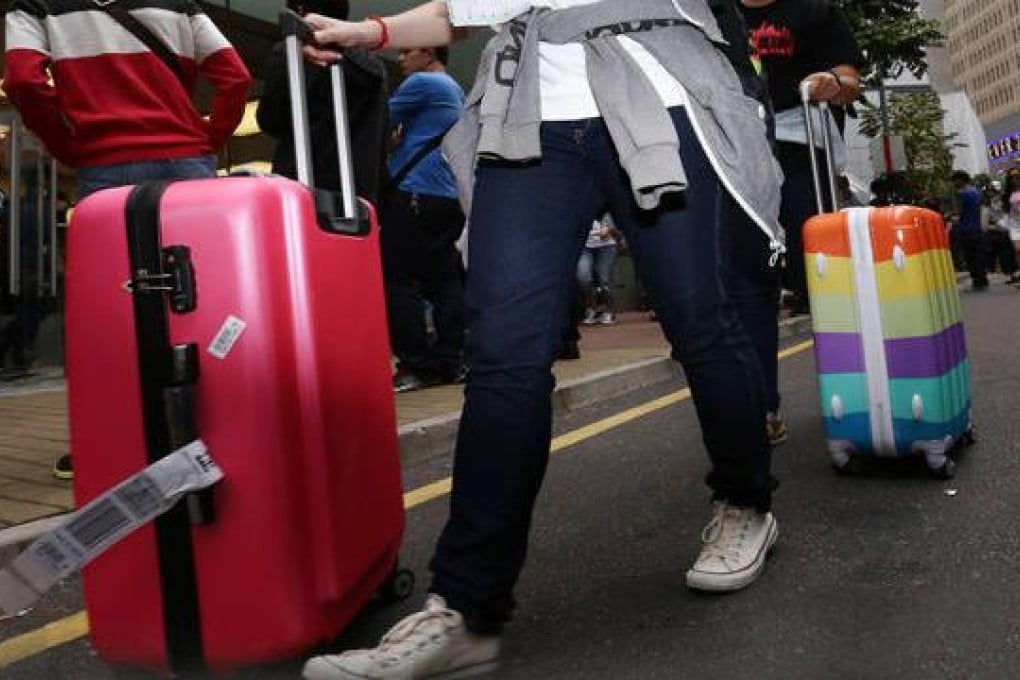 In Hong Kong, you can barely turn a corner without seeing a wheeled bag or suitcase.