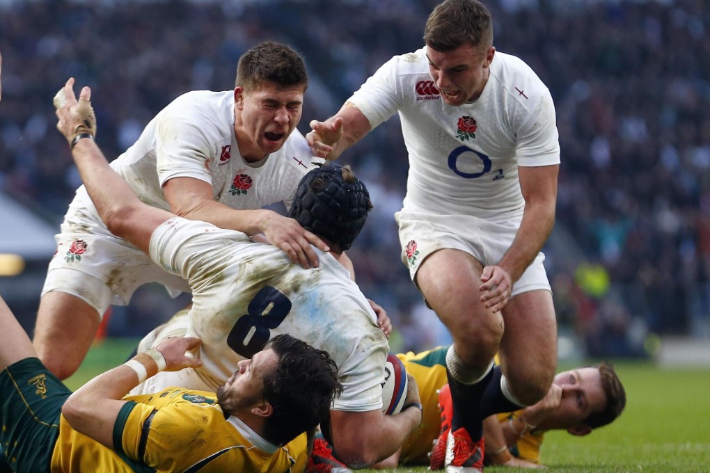 England team-mates embrace Ben Morgan after his try. Photo: Reuters