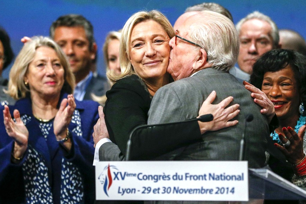 Marine Le Pen receives congratulations from her father, Jean-Marie Le Pen, after winning the National Front election. Photo: Reuters