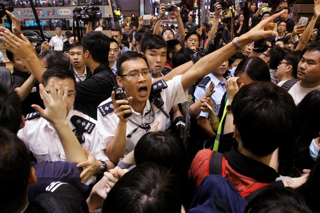 Police officers clash with pro-democracy protesters in Mong Kok. Photo: Edward Wong