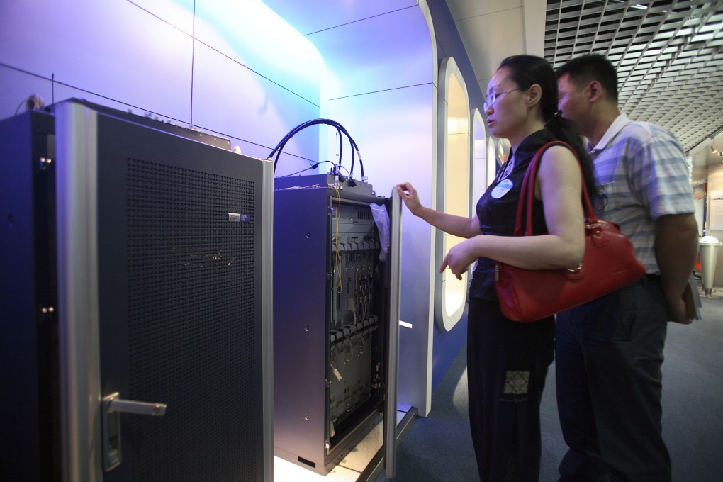 Visitors look at the broadband equipment of ZTE in Shanghai, China. The plan by Beijing to widen participation in the country's fixed-line broadband market may falter. Photo: Bloomberg
