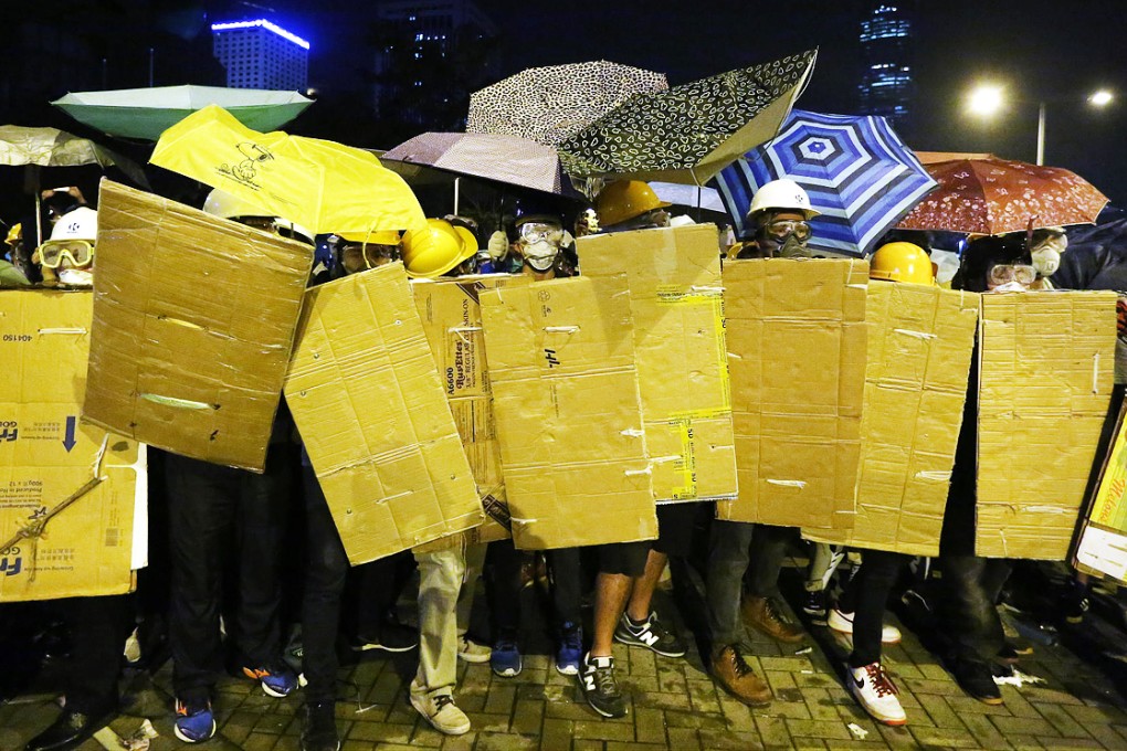 Tense stand-offs, arrests and clashes between police and protesters marked yesterday's fresh eruption of violence in and around Admiralty. Photo: Sam Tsang