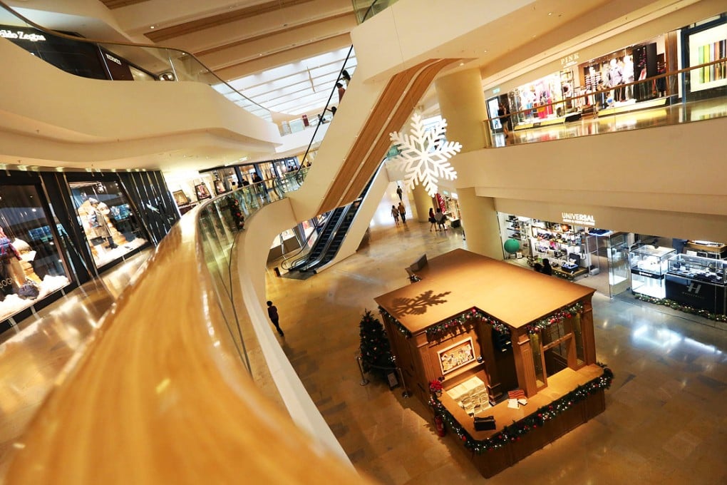 Christmas shoppers were thin on the ground in Pacific Place yesterday. A spokeswoman for owner Swire Properties admitted the protests had affected business. Photo: Felix Wong