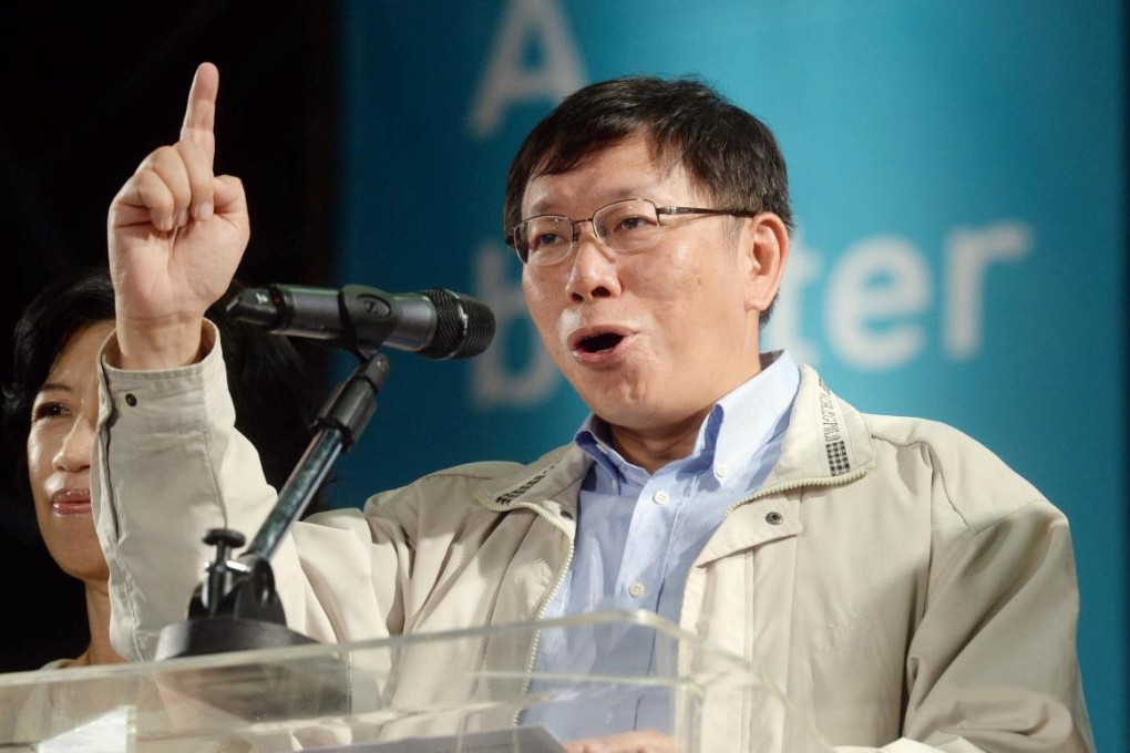 Ko Wen-je speaks at a news conference after his victory in the Taipei mayoral election. Photo: Kyodo