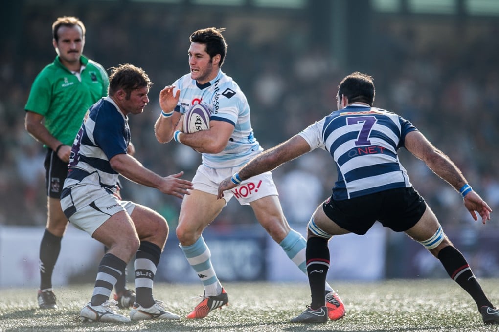 Elite Referees Panel member Tim Baker (left) keeps a close eye on proceedings during the recent Natixis Cup. Photos: HKRFU