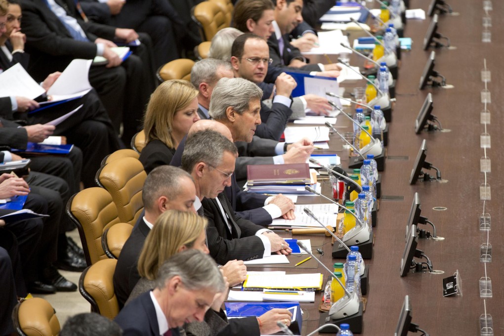 US Secretary of State John Kerry (front centre) chairs a round-table meeting at Nato headquarters. Photo: AP