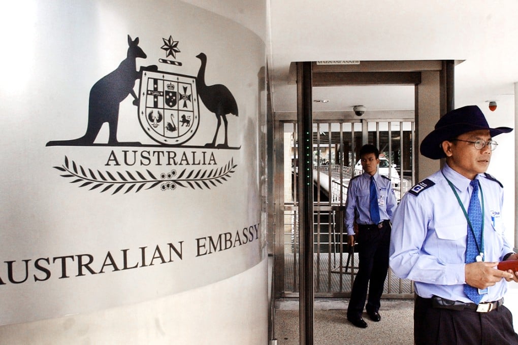 Thai security personals stand guarding at the gate to the Australian Embassy in Bangkok, Thailand. Photo: AP
