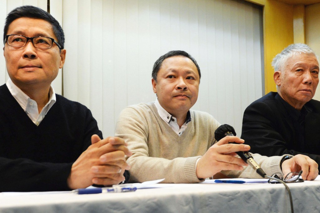 (From left) Chan Kin-man, Benny Tai and Chu Yiu-ming say they will surrender to police and call off the occupation campaign. Photo: Kyodo