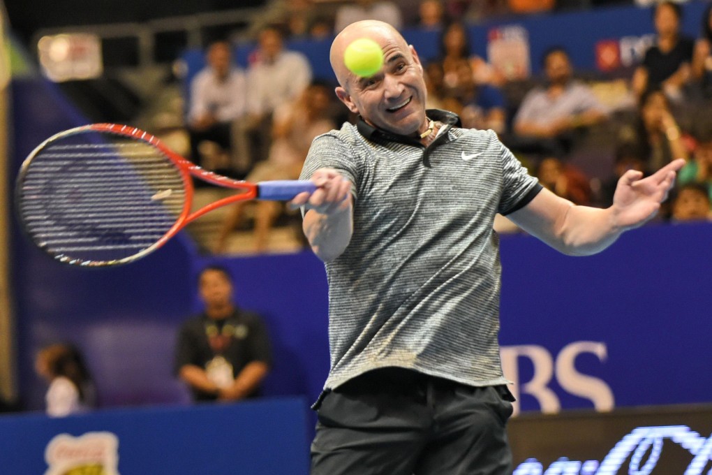 Andre Agassi, of the Singapore Slammers team, in action during  the International Premier Tennis League competition leg in Singapore. Photo: AFP