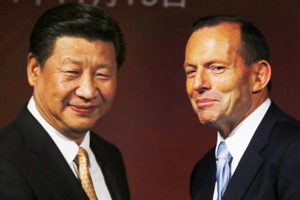 President Xi Jinping (left) and Australian Prime Minister Tony Abbott have agreed to improve military cooperation between the two states. The two leaders met in Sydney last month. Photo: AFP