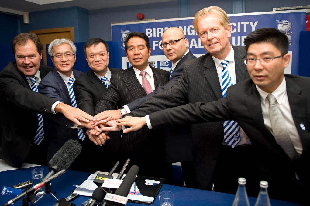 Carson Yeung (centre) and Peter Pannu (third from right)