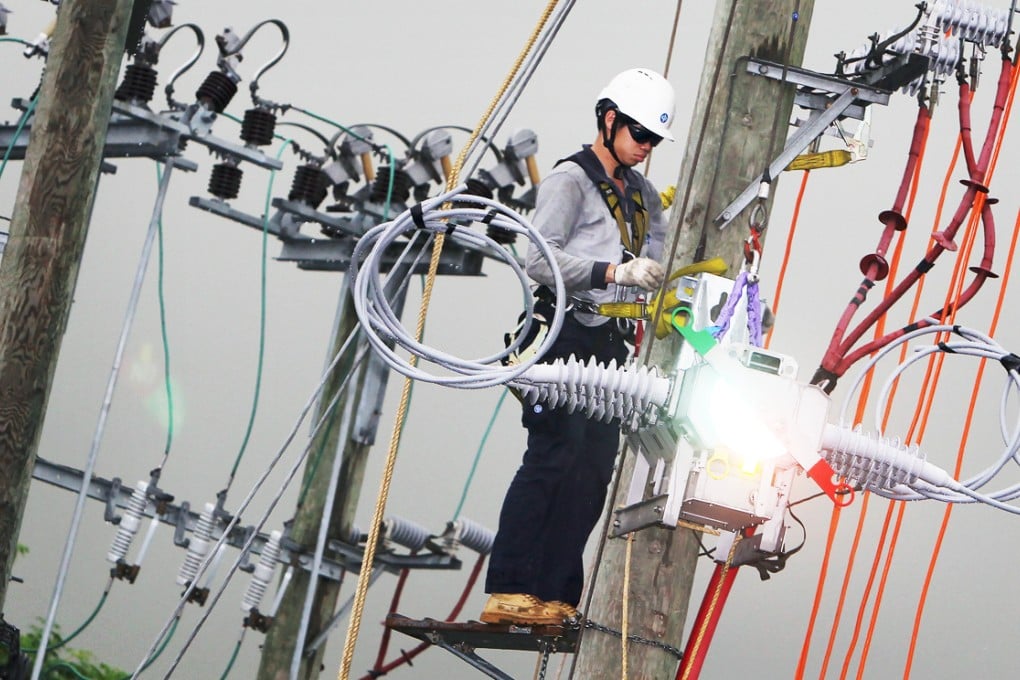 A worker from CLP does repairs. Photo: Felix Wong
