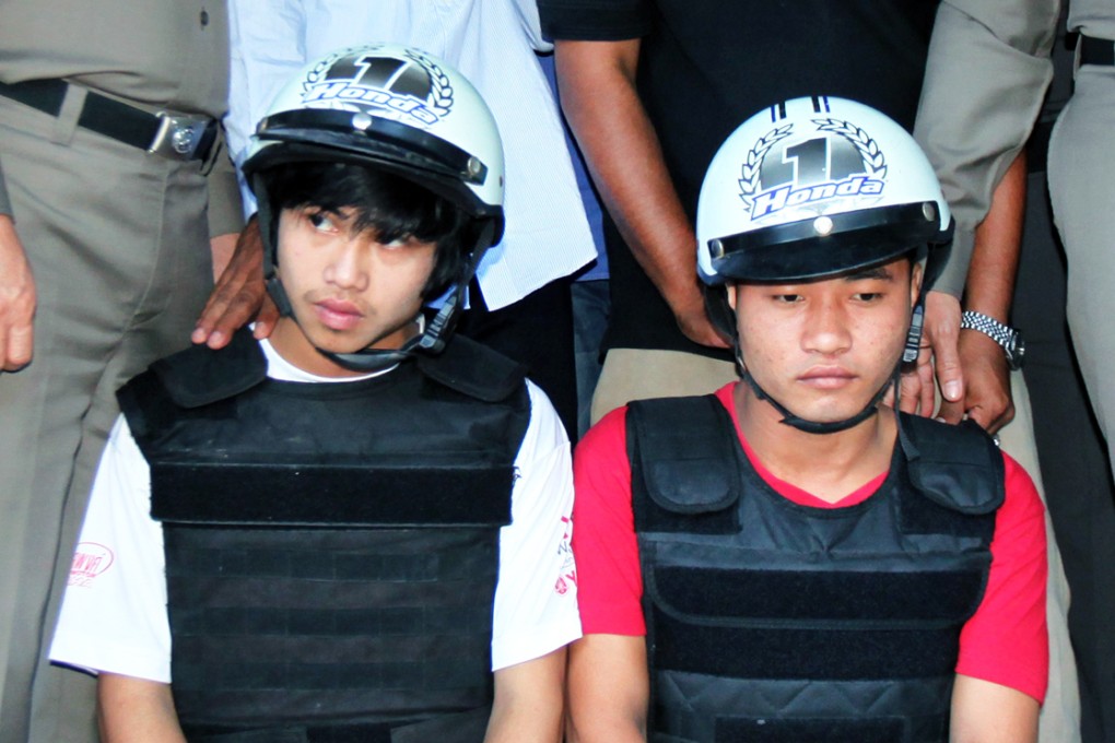 The Myanmar migrant workers Win Zaw Tun (left) and Zaw Lin (right) appear at a police press conference in Koh Tao island, Thailand. Photo: EPA