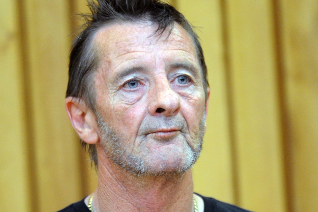 AC/DC drummer Phil Rudd appears in the High Court for charges of drug posession and threatening to kill. Photo: EPA