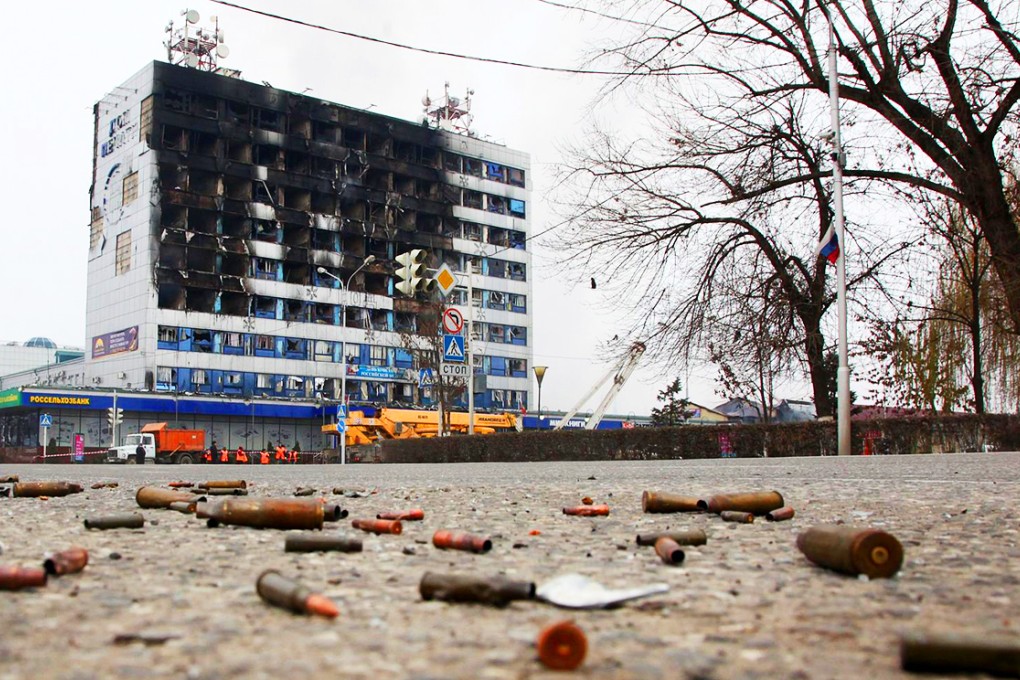 Spent shells on the ground outside the burnt-out publishing house in the centre of Grozny. Photo: AFP