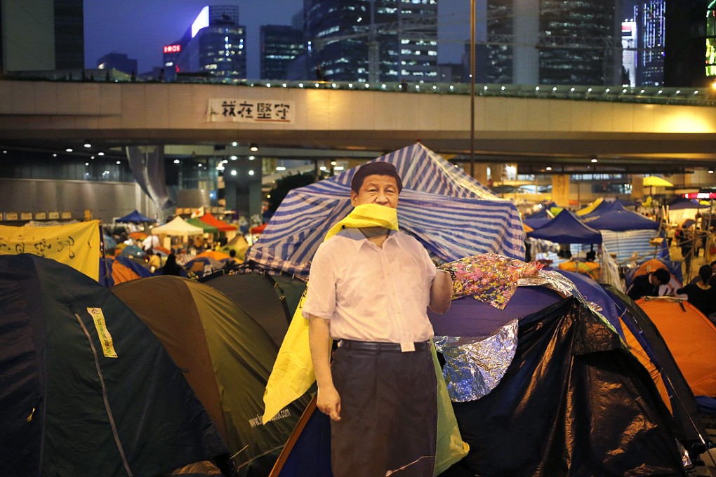 A life-sized cut-out of President Xi Jinping is seen in the Admiralty protest site. Photo: EPA