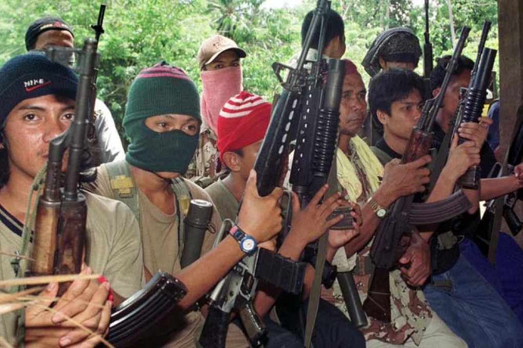 A file photo of Abu Sayyaf gunmen operating in the southern Philippines, engaged in a decades-long insurgency. Photo: AFP