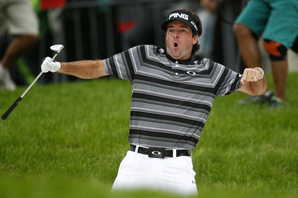 Bubba Watson reacts after a shot out of the bunker on the 18th hole during the WGC-HSBC Champions golf tournament in Shanghai. He eventually won. Photo: Reuters