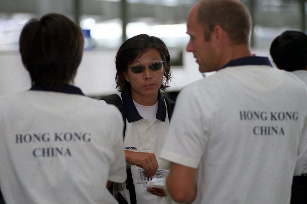 Olympic gold medallist Lee Lai-shan talks with her husband, Sam Wong Tak-sum and coach Rene Appel in 2002. Photo: Antony Dickson