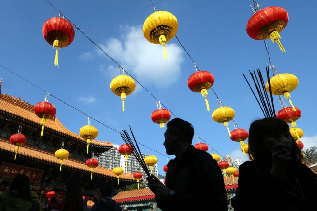 Believers praying at Wong Tai Sin Temple in Wong Tai Sin. Photo: K. Y. Cheng