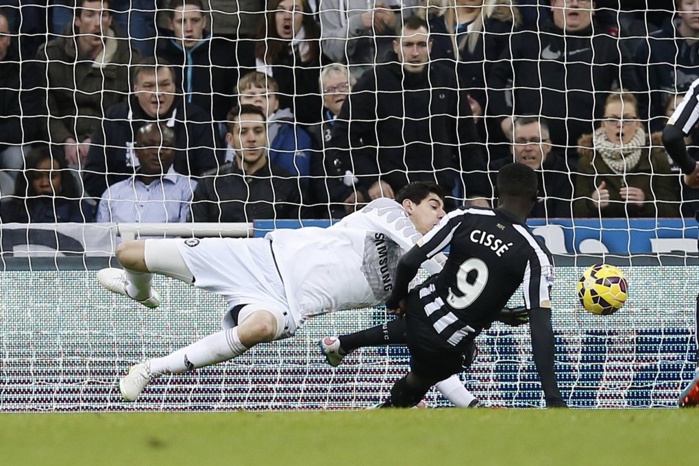 Newcastle United's Papiss Cisse scores the opening goal past Chelsea's Thibaut Courtois at St James' Park. Photo: Reuters