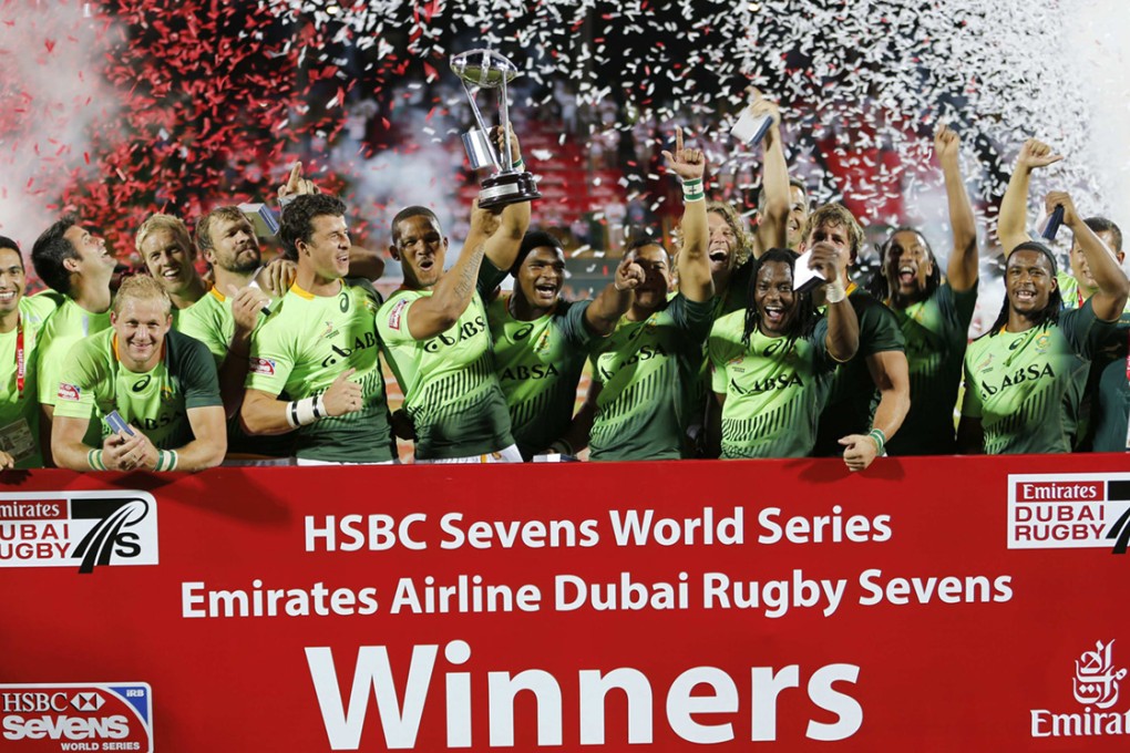 South Africa celebrate with the trophy after crushing Australia 33-7 to win the Dubai Sevens. Photo: Reuters