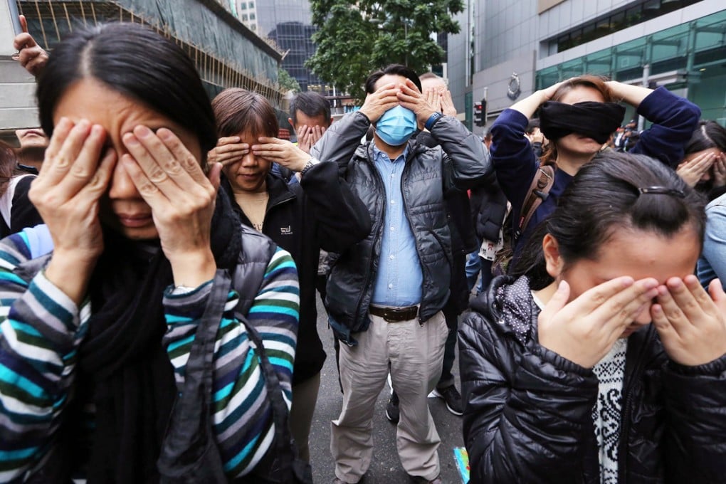 Protesters at police headquarters yesterday. Photo: Sam Tsang