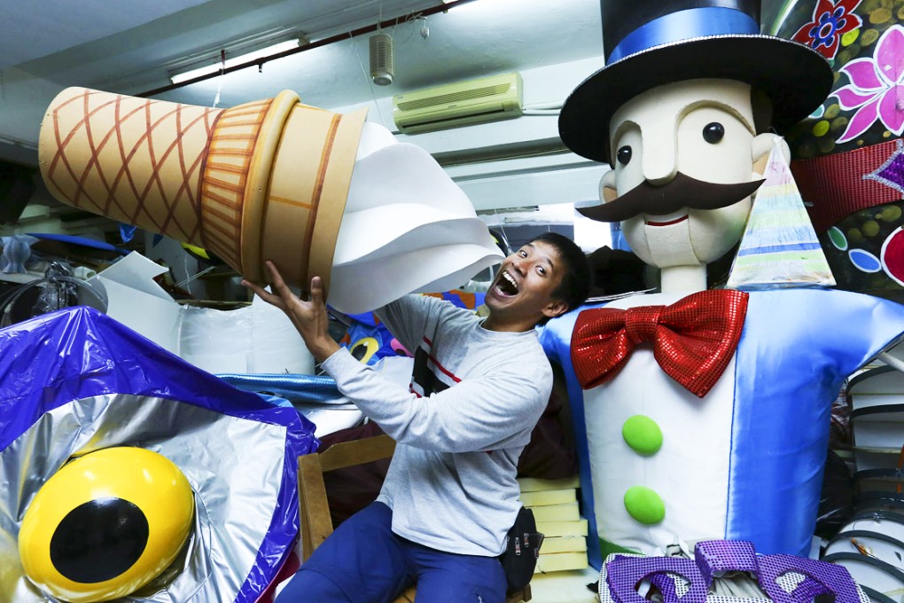 Puppet maker Paul Chan shows off some pieces at his studio.