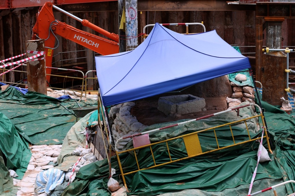 Construction work at Shatin-Central link To Kwa Wan MTR site has been suspended due to unearthed ancient relics (sheltered by blue tent in the picture). Photo: Nora Tam