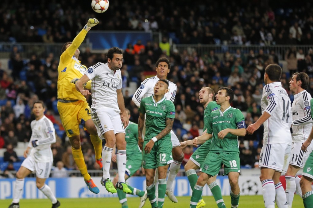 Ludogorets keeper Vladislav Stoyanov punches the ball clear under pressure. Photo: AP