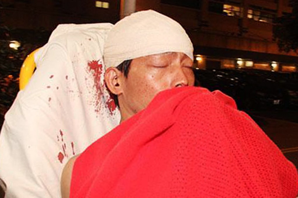 The victims operated a money exchange shop and mobile phone repairs shop in Kwai Chung. Photo: SCMP