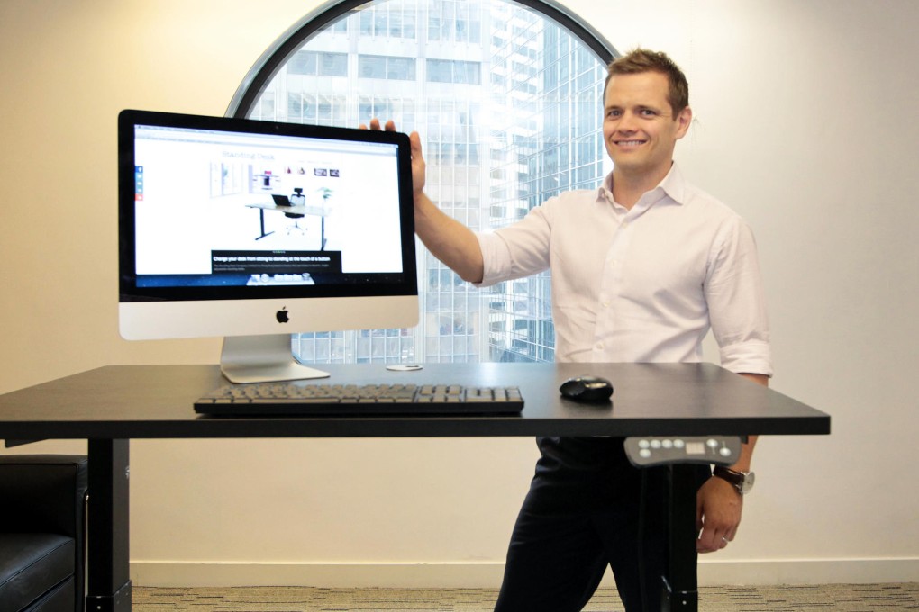 Physiotherapist and businessman Chris Sherer with his stand-up desk.Photo: Bruce Yan