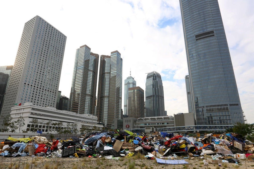 Tents, barricades and supplies from the Admiralty Occupy site lie dumped in a plot of land on the Central harbourfront yesterday, a day after the clearance. Photo: Edmond So