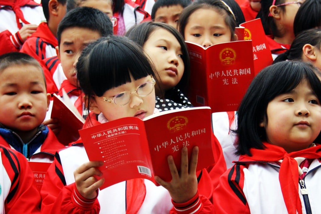 Students in Chongqing get acquainted with the Chinese constitution. Photo: AFP