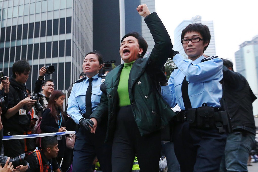 Police take away Emily Lau from Occupy's Admiralty site. Photos: Sam Tsang