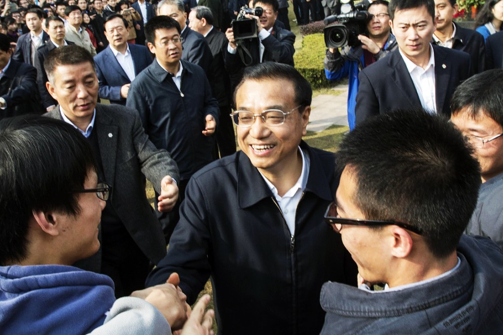 Premier Li Keqiang mingles with students at the Zhejiang University late last month. Photo: Xinhua