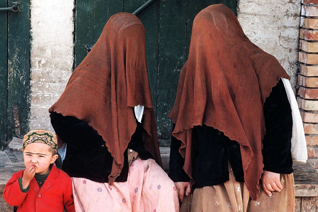 Uygur women wearing full face veils in Xinjiang, where the practice is becoming more commonplace. Photo: Imaginechina