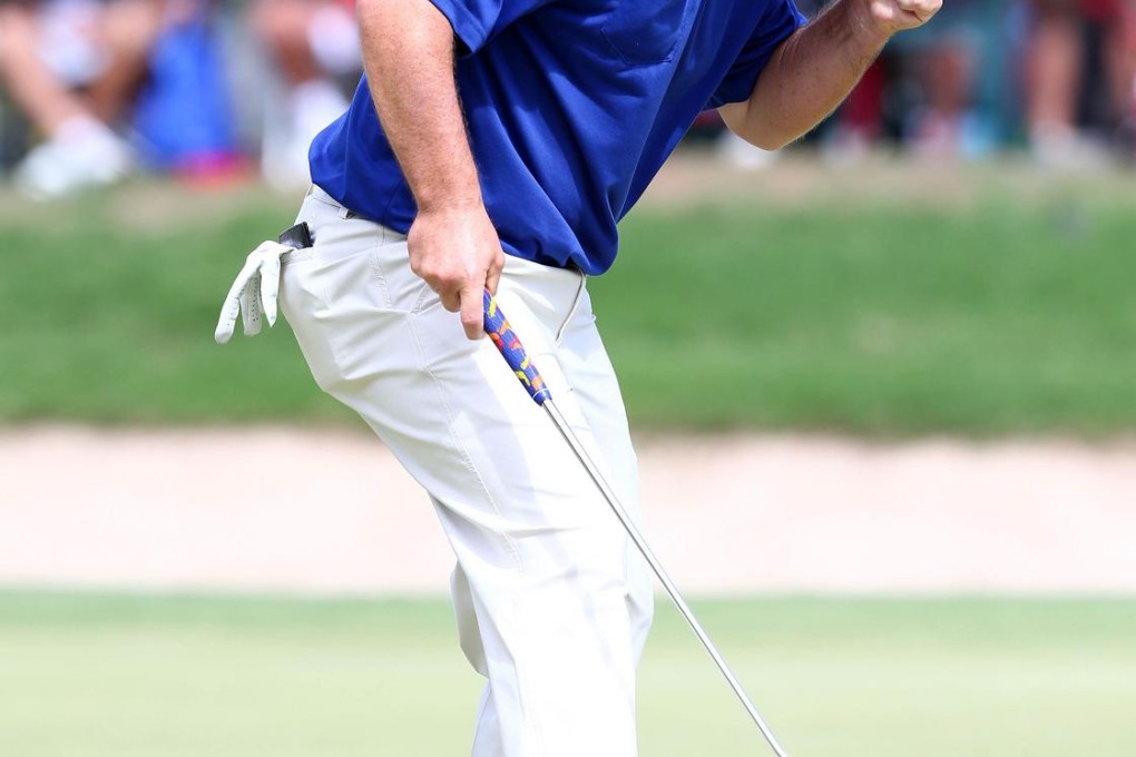 Greg Chalmers celebrates his winning birdie. Photo: AFP
