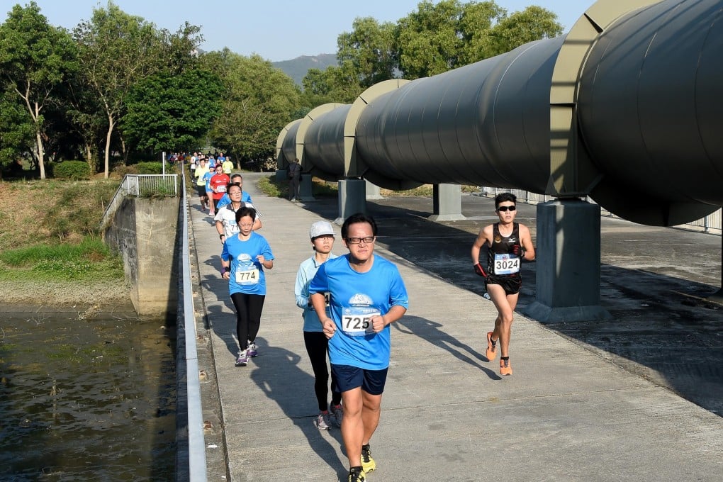Yu Hin-wa hits the 14.5km mark as he passes the mainland water pipe. Photo: Richard Castka