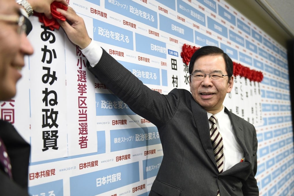 Japanese Communist Party leader Kazuo Shii  smiles as he receives the results of the lower house election at the party's headquarters in Tokyo. Photo: Kyodo