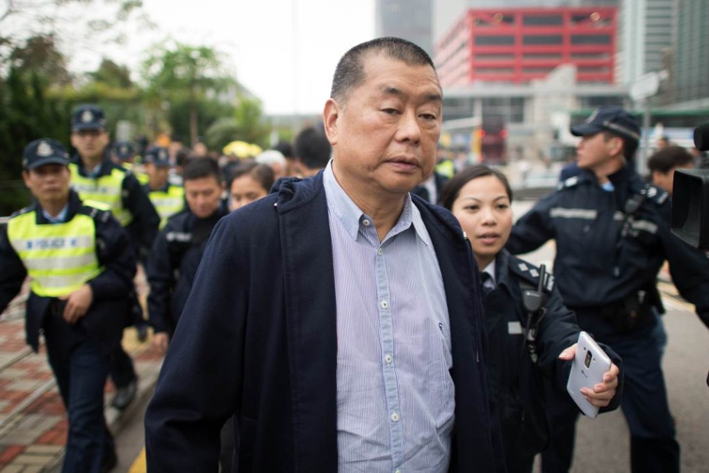 Media tycoon Jimmy Lai resigns as Next Media chairman