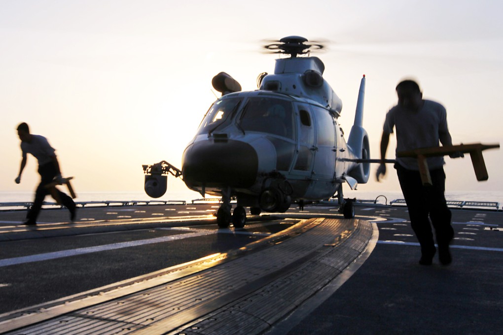 A People's Liberation Army helicopter destroyed a drone that sparked a security alert while flying over the skies near Beijing. File picture: Xinhua