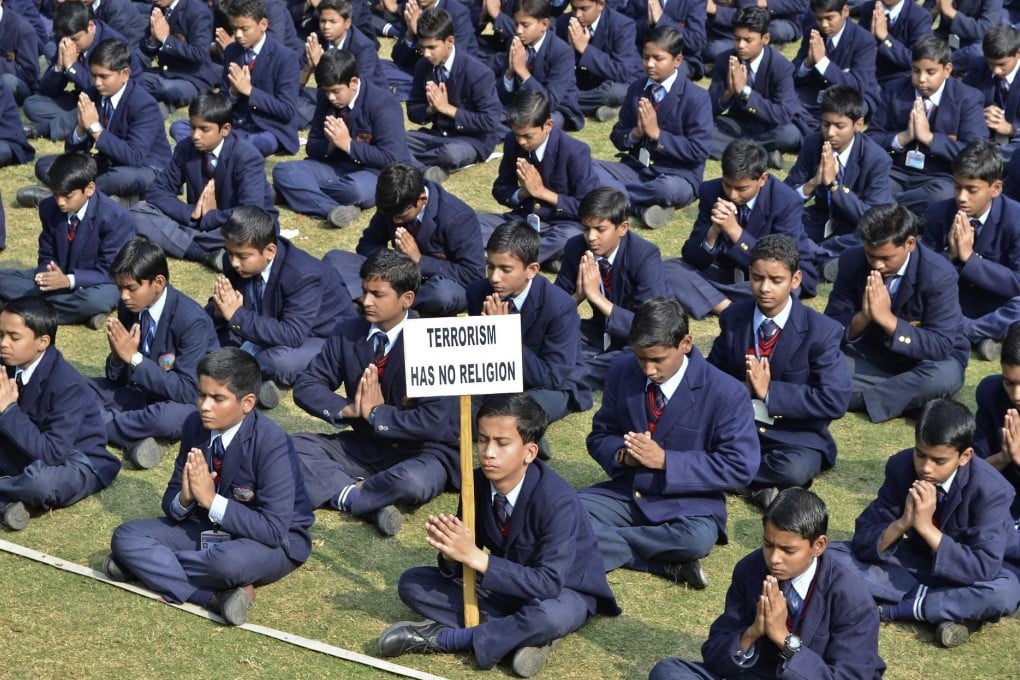 Children in the Indian city of Mathura take part in a prayer for victims of Tuesday's Taliban attack on a school in Peshawar.Photo: Reuters