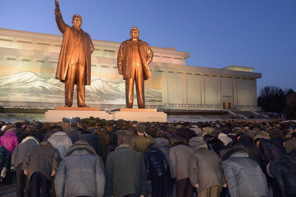 Two bronze statues of North Korea's late founder Kim Il-sung (left) and late leader Kim Jong-il formed the centrepiece of the memorial ceremony at Mansu Hill in Pyongyang. Photo: Kyodo