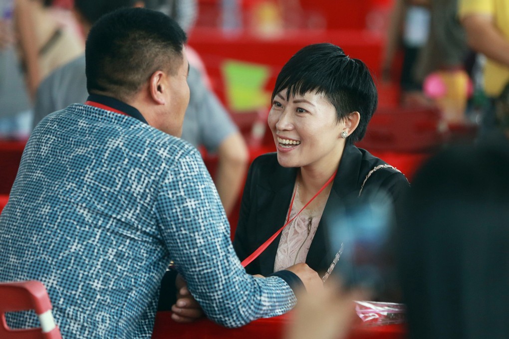 Singles attend a matchmaking event in Dongguan. Many women today seek not only a good career but also a happy family life. Photo: AFP