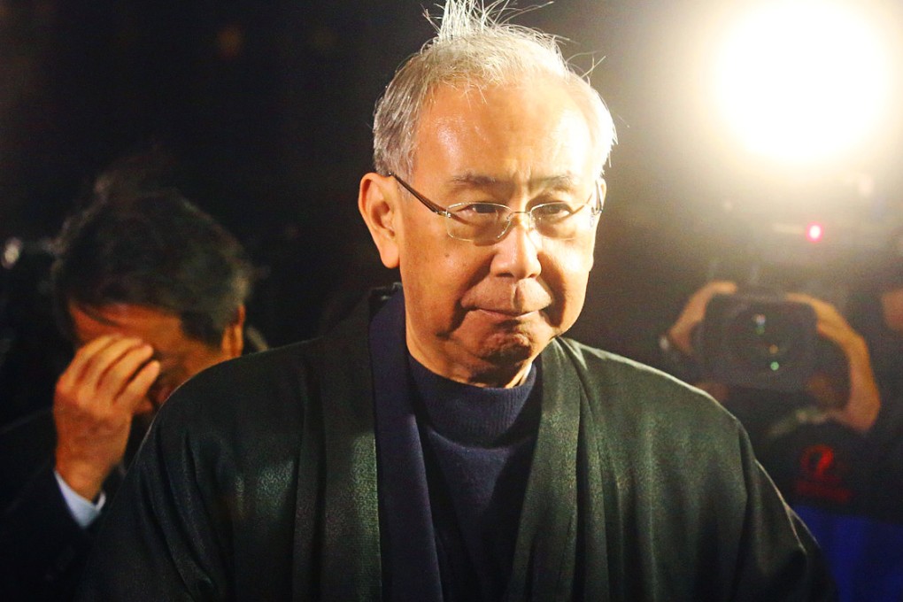 Rafael Hui Si-yan departs the High Court at night. Photo: Sam Tsang