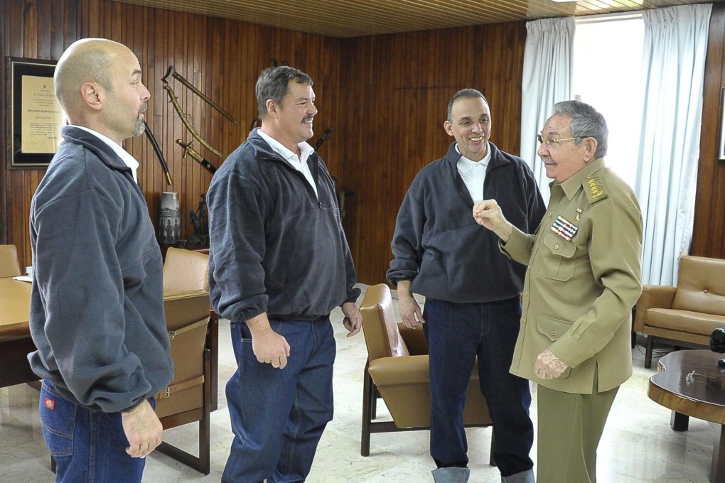 Three of the "Cuban Five" spies released as part of a prisoner swap talk with Cuban President Raul Castro (right). Photo: EPA