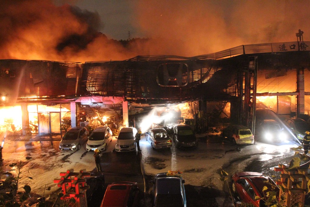 Firefighters battle a blaze at the Guoqin Department Store in Dongguan. Photo: Xinhua
