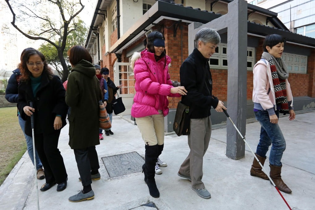 The walking tour around North Point was a trial run to see whether it could be interesting to both blind and sighted participants. Photo: Jonathan Wong